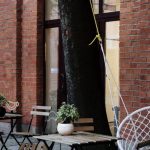 Outdoor Living Area - Tables Chairs and Swing Chair at Outdoor Cafe