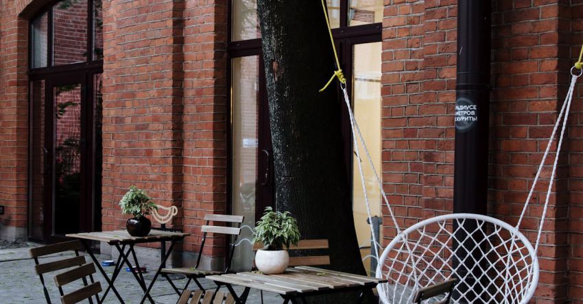 Outdoor Living Area - Tables Chairs and Swing Chair at Outdoor Cafe