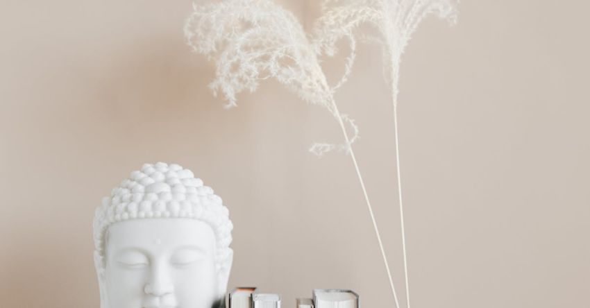 Historic Home - Vase with dried herbs arranged with Buddha bust and books